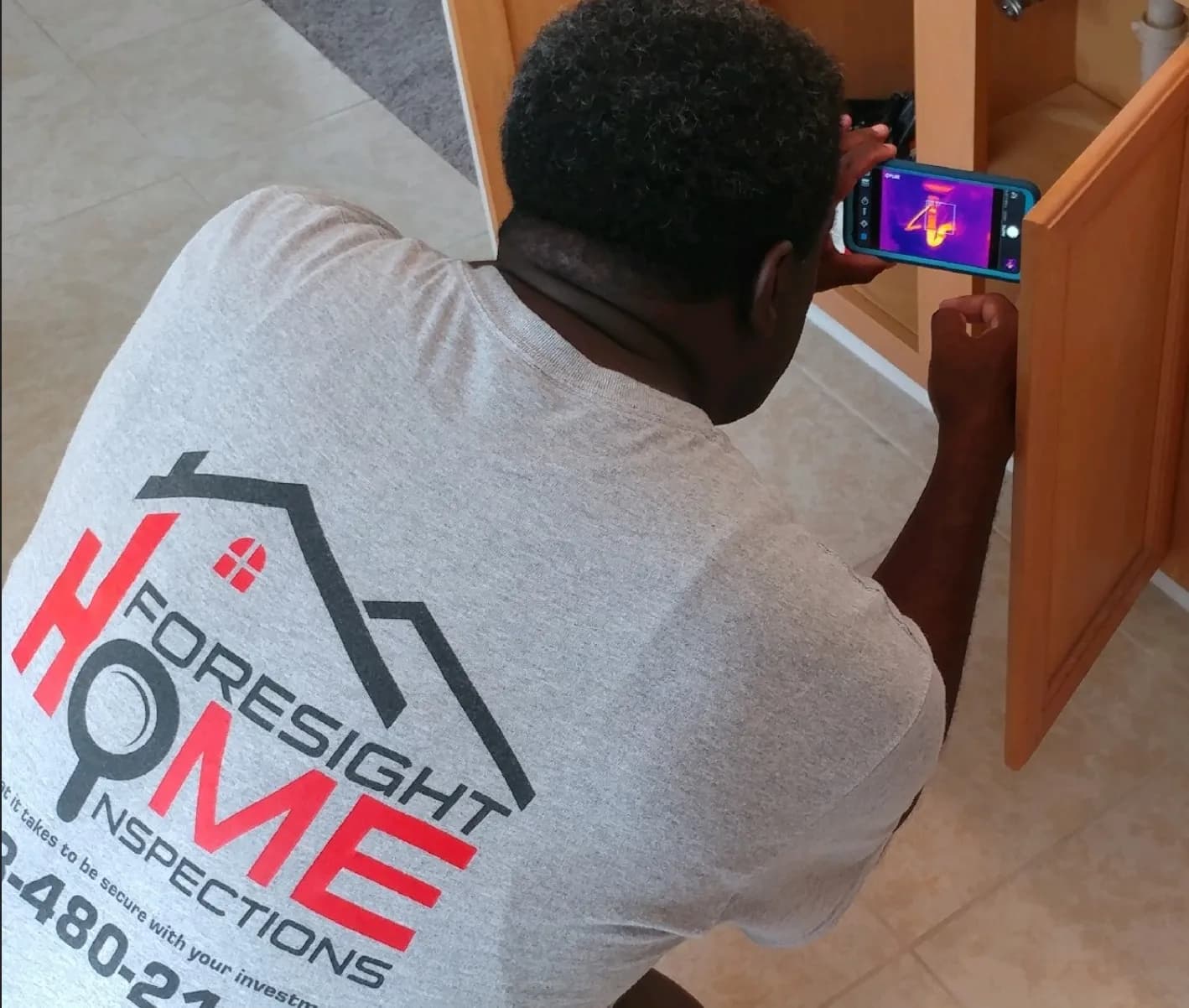 Infrared Thermal Imaging (FLIR) camera inspecting home electrical heat profile